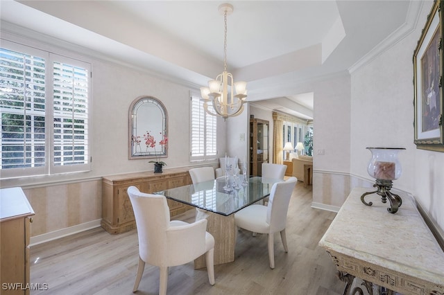 2000 Royal Marco Way Beach Cottage #11, Marco Island, FL 34145 - dining area with a chandelier, light wood-style floors, baseboards, a tray ceiling, and ornamental molding