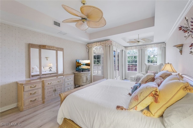 2000 Royal Marco Way Beach Cottage #11, Marco Island, FL 34145 - bedroom featuring light wood-style flooring, crown molding, wallpapered walls, a ceiling fan, and a raised ceiling