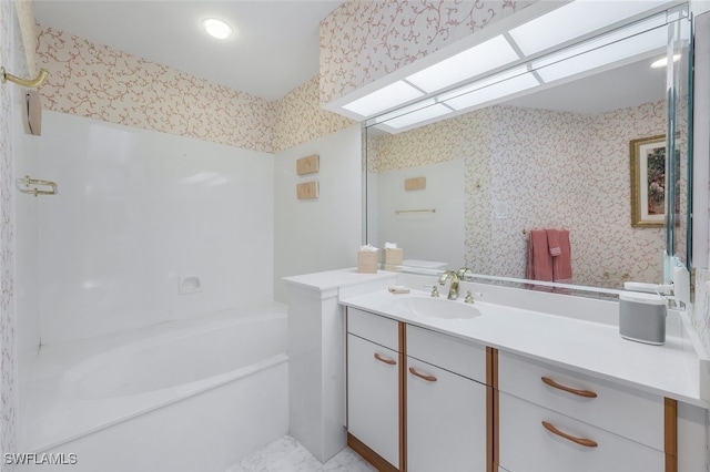 2000 Royal Marco Way Beach Cottage #11, Marco Island, FL 34145 - bathroom featuring wallpapered walls and vanity