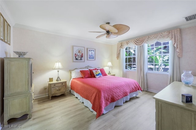 bedroom with ornamental molding, light hardwood / wood-style floors, and ceiling fan