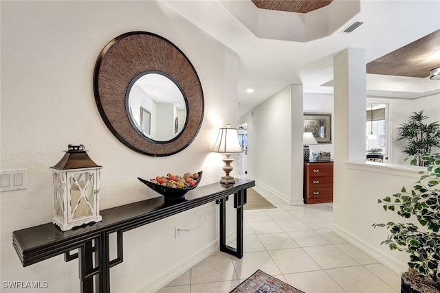 corridor featuring light tile patterned floors