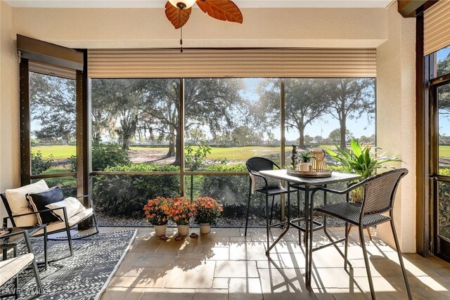 sunroom / solarium with ceiling fan