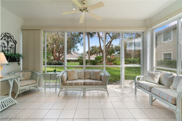 sunroom / solarium featuring ceiling fan