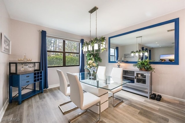 dining area with hardwood / wood-style flooring