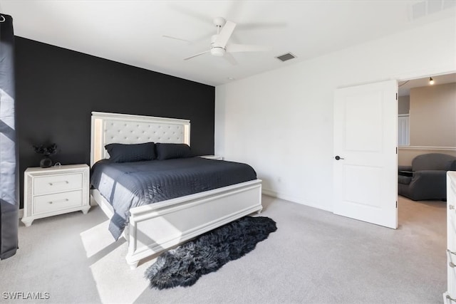 bedroom with light colored carpet and ceiling fan