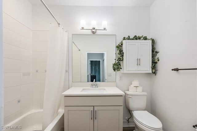 full bathroom featuring vanity, toilet, and shower / bath combination with curtain