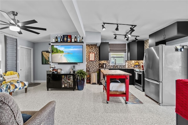 interior space with ceiling fan and sink