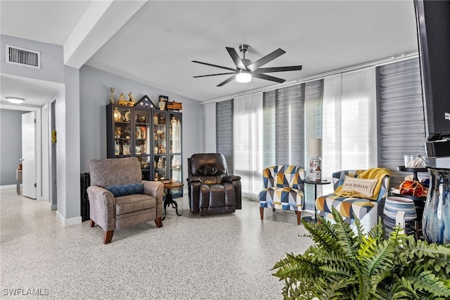 living area featuring ceiling fan