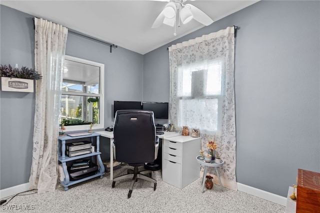 carpeted home office with ceiling fan and lofted ceiling