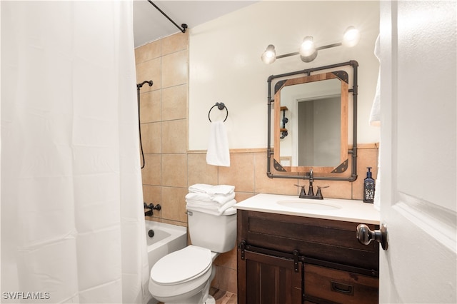 full bathroom featuring vanity, tile walls, toilet, and shower / bathtub combination with curtain