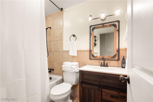 11831 Iona Rd, Fort Myers, FL 33908 - full bathroom with tile walls, vanity, toilet, and shower / tub combo