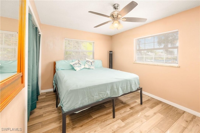 11831 Iona Rd, Fort Myers, FL 33908 - bedroom featuring light wood-type flooring, baseboards, and ceiling fan