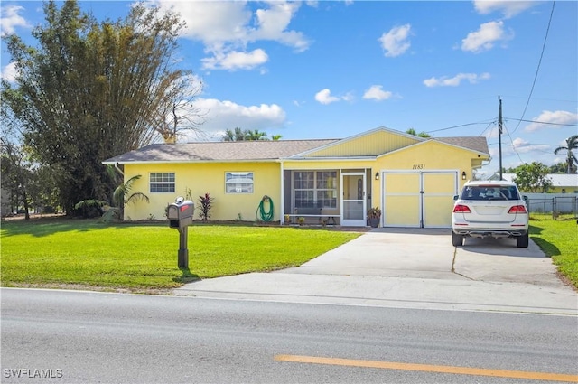 11831 Iona Rd, Fort Myers, FL 33908 - ranch-style house with driveway, a front lawn, stucco siding, and a garage