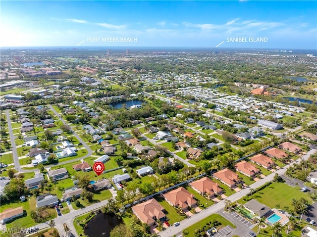 bird's eye view with a water view