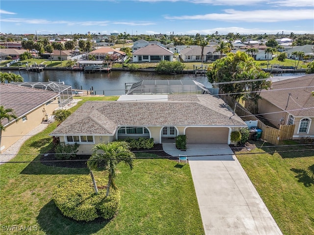 birds eye view of property featuring a water view