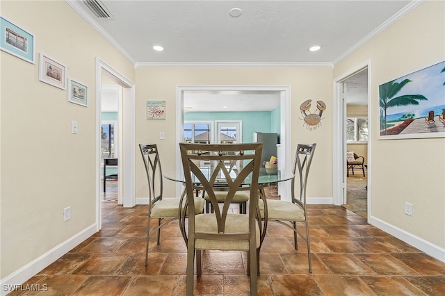 dining room with crown molding