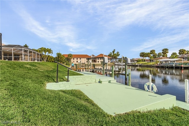 view of home's community featuring a yard, a water view, and a dock