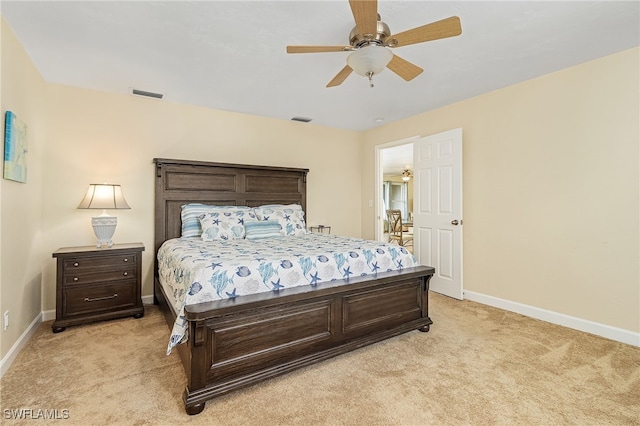 bedroom featuring light carpet and ceiling fan