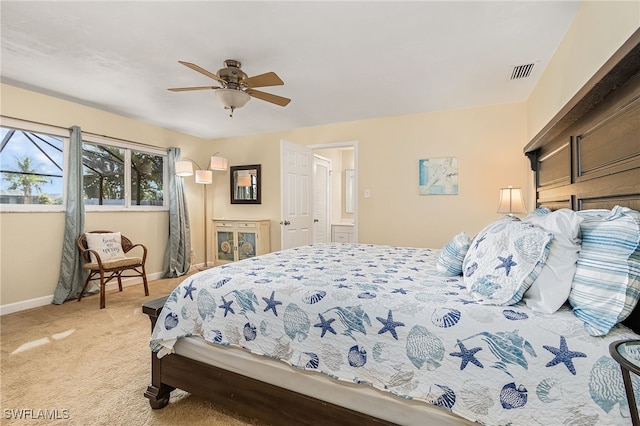 bedroom featuring light colored carpet and ceiling fan