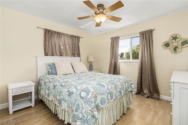 bedroom featuring light hardwood / wood-style floors and ceiling fan