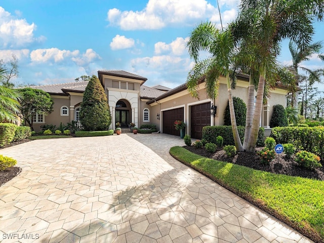 mediterranean / spanish-style home featuring a garage