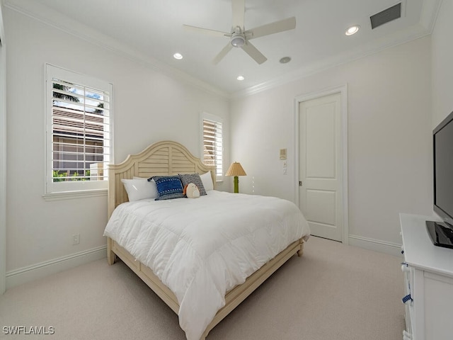 bedroom with multiple windows, crown molding, and light colored carpet