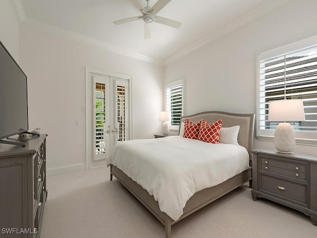 bedroom featuring access to outside, light colored carpet, ceiling fan, crown molding, and french doors