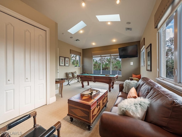 game room featuring pool table, a skylight, and light carpet