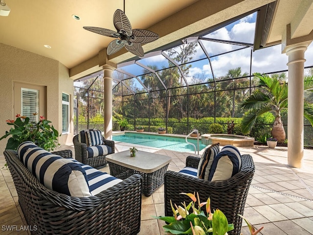 view of patio with a swimming pool with hot tub, ceiling fan, outdoor lounge area, and glass enclosure