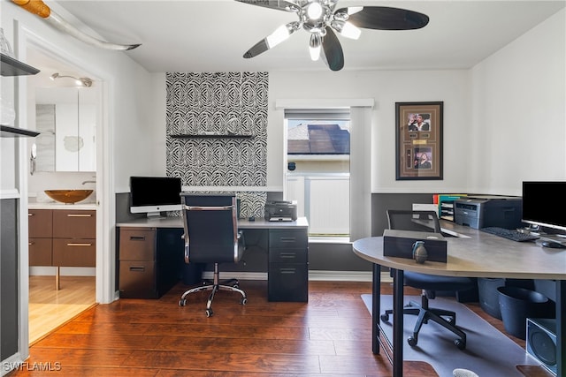 office area featuring ceiling fan and dark hardwood / wood-style floors