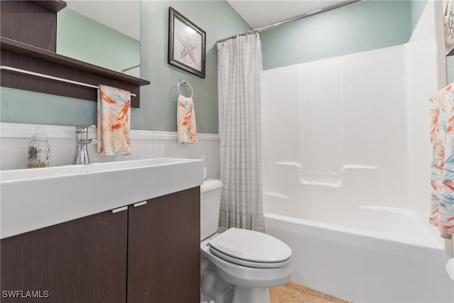 bathroom featuring shower / tub combo with curtain, tile patterned floors, and toilet