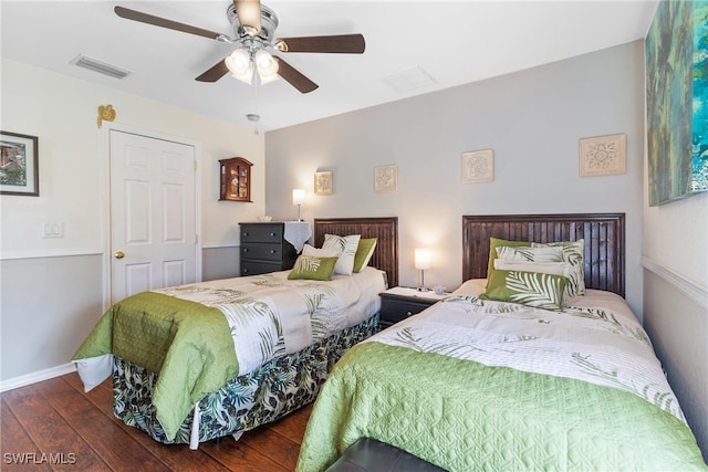 bedroom with dark wood-type flooring and ceiling fan