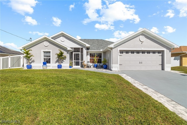 ranch-style house featuring a garage and a front yard