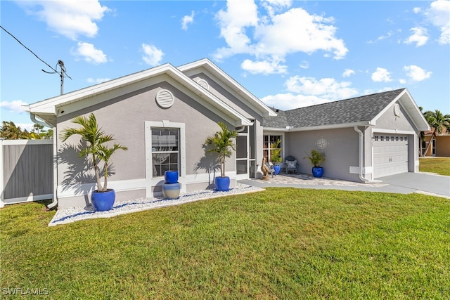 view of front facade with a garage and a front yard