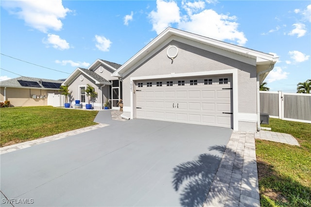 ranch-style home featuring a front lawn and a garage