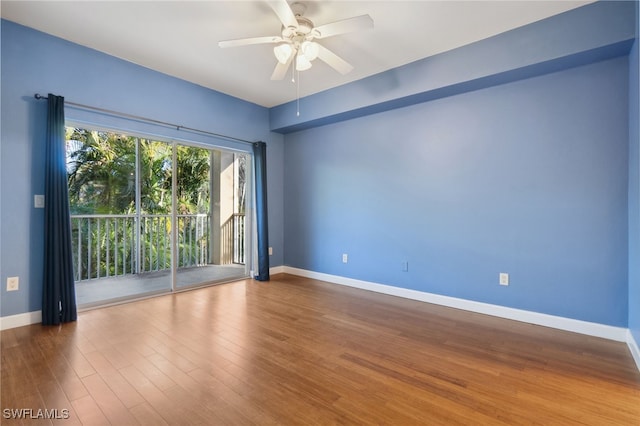 unfurnished room with ceiling fan and hardwood / wood-style floors