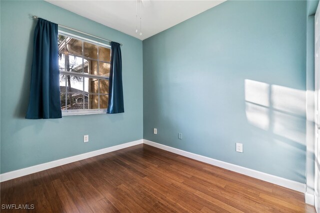 spare room with hardwood / wood-style floors