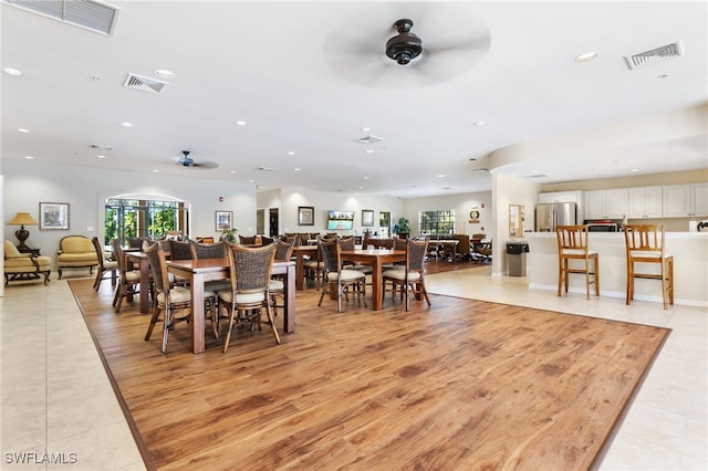 dining room featuring light hardwood / wood-style flooring and ceiling fan