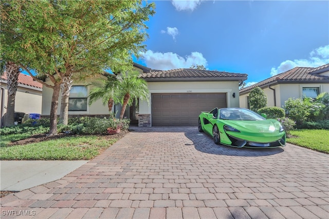 mediterranean / spanish-style house featuring a garage