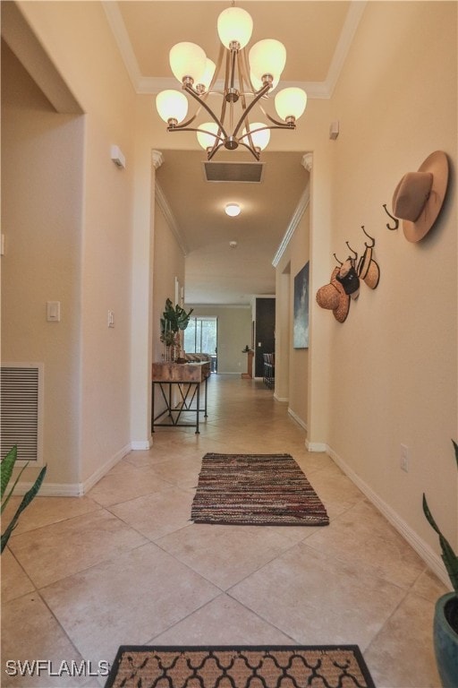 corridor with crown molding and a notable chandelier