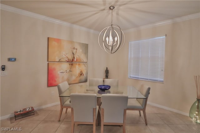 tiled dining area featuring ornamental molding and a chandelier