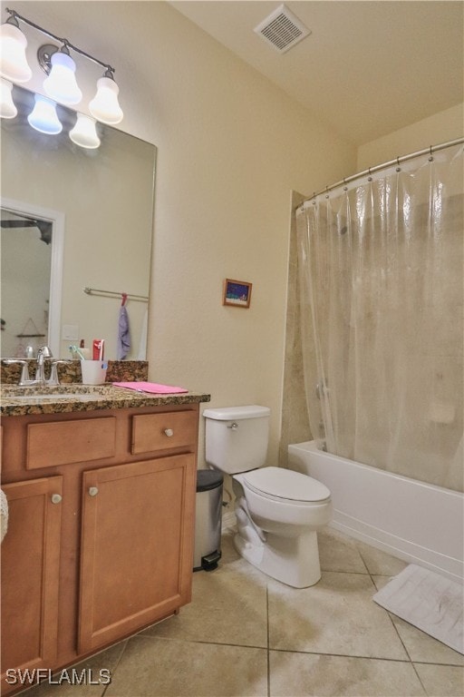 full bathroom featuring vanity, shower / bath combo with shower curtain, toilet, and tile patterned flooring