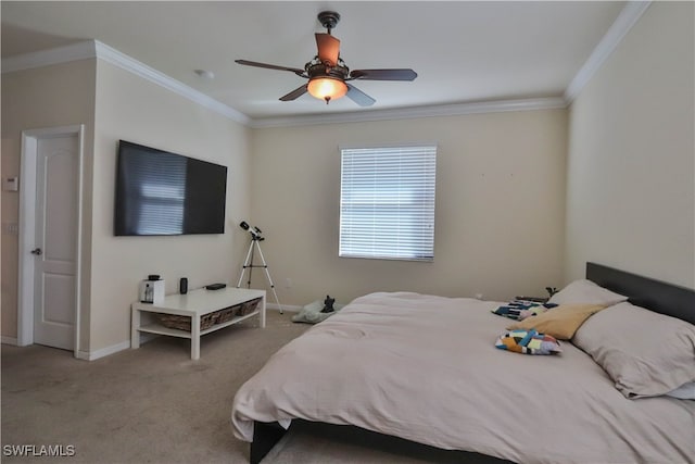 carpeted bedroom featuring ornamental molding and ceiling fan