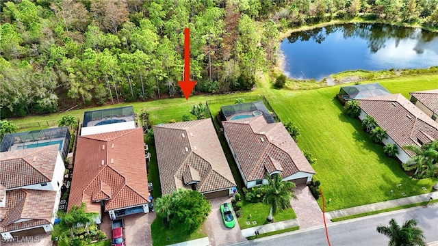 birds eye view of property featuring a water view