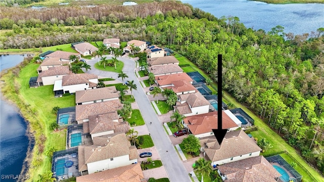 birds eye view of property with a water view