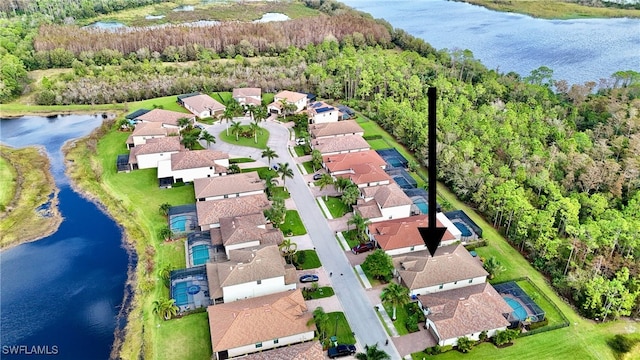 drone / aerial view with a water view