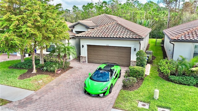 mediterranean / spanish-style house with a front lawn and a garage