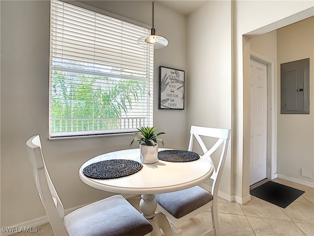 tiled dining room featuring electric panel