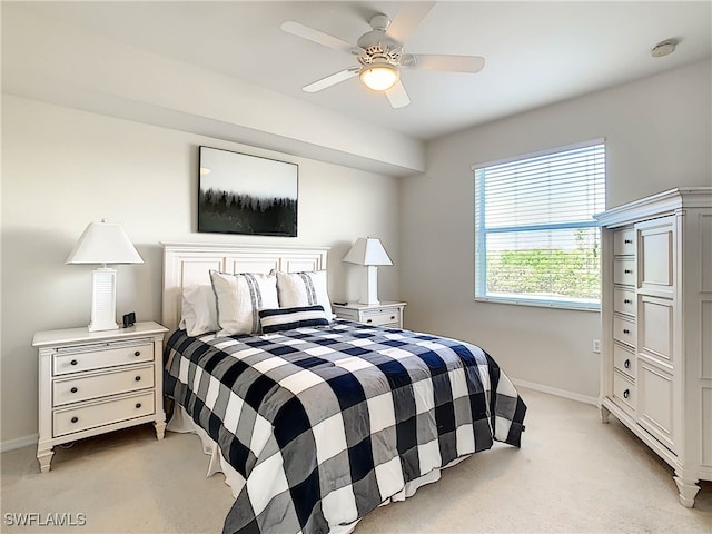 bedroom featuring ceiling fan and light colored carpet