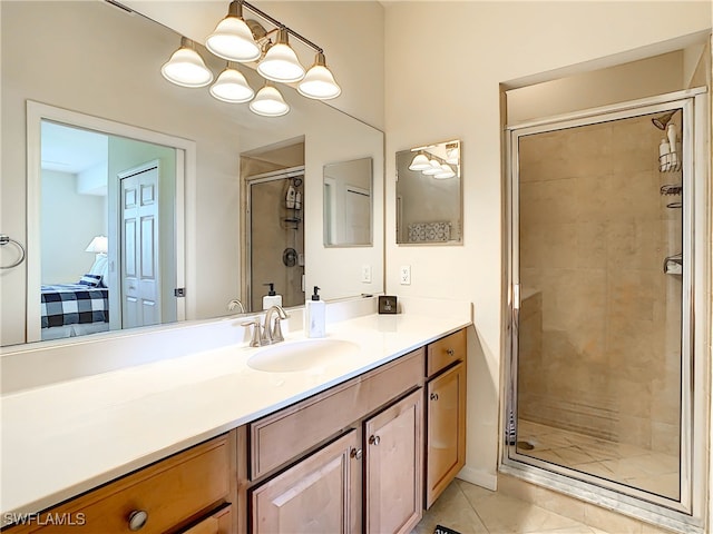 bathroom with vanity, tile patterned flooring, and an enclosed shower